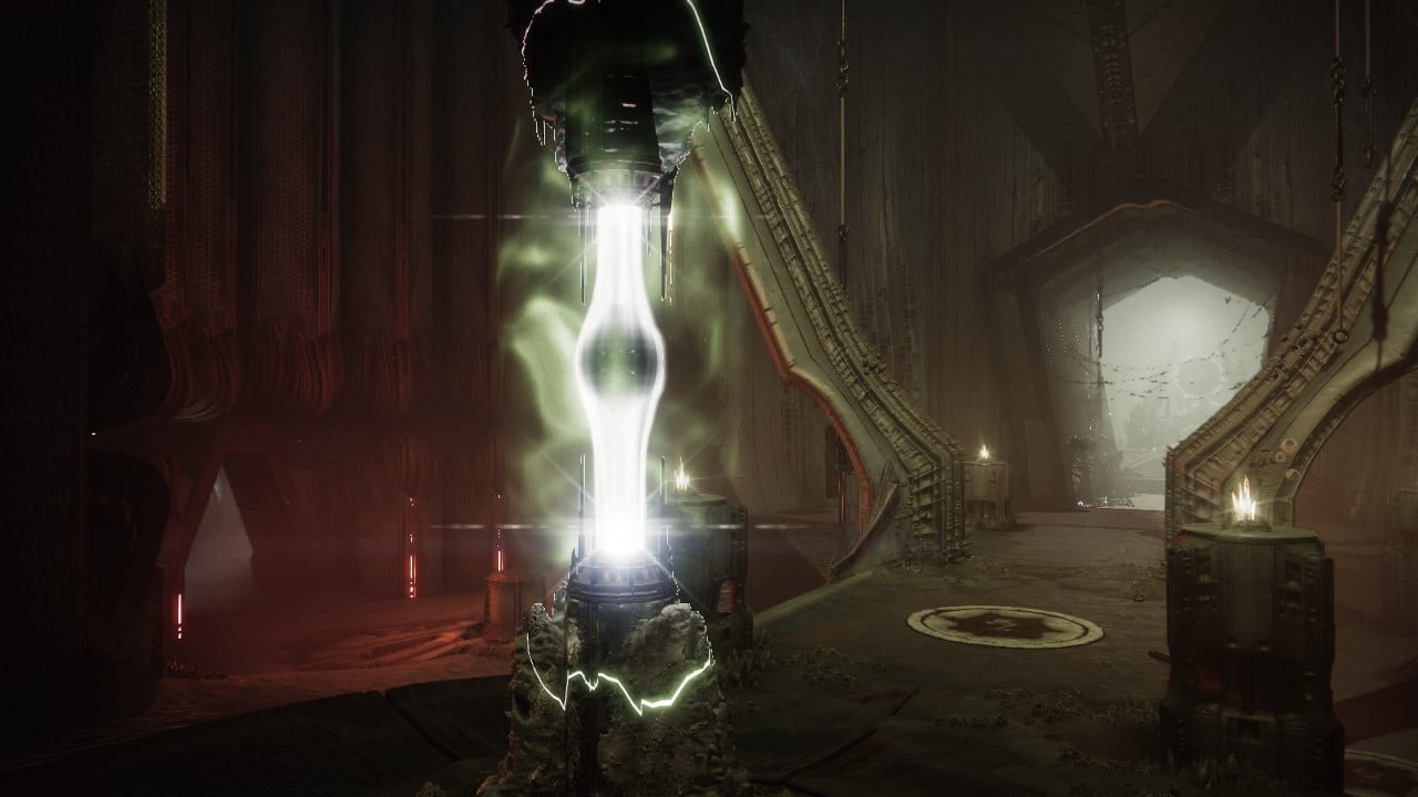 Un pilier de lumière verte dans une salle de la Ruche
