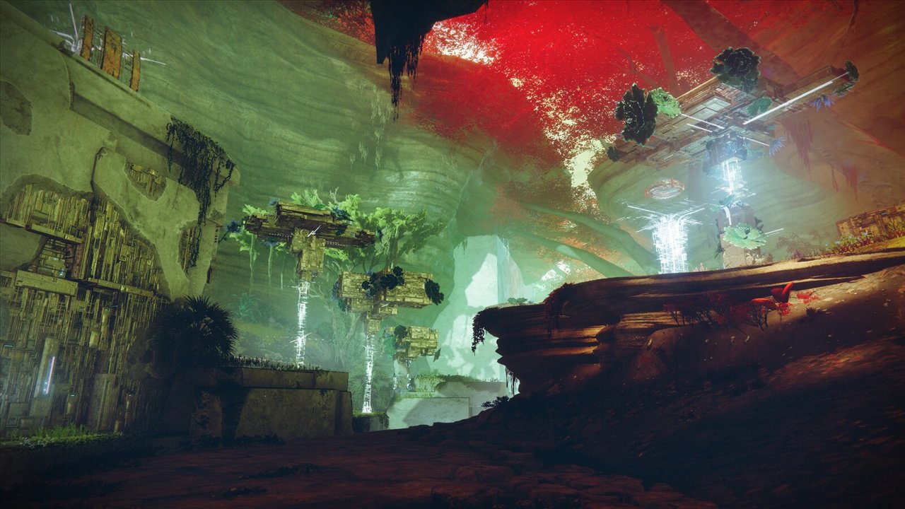 Une caverne de Nessos envahie de végétation, un ciel rouge au-dessus des structures vex